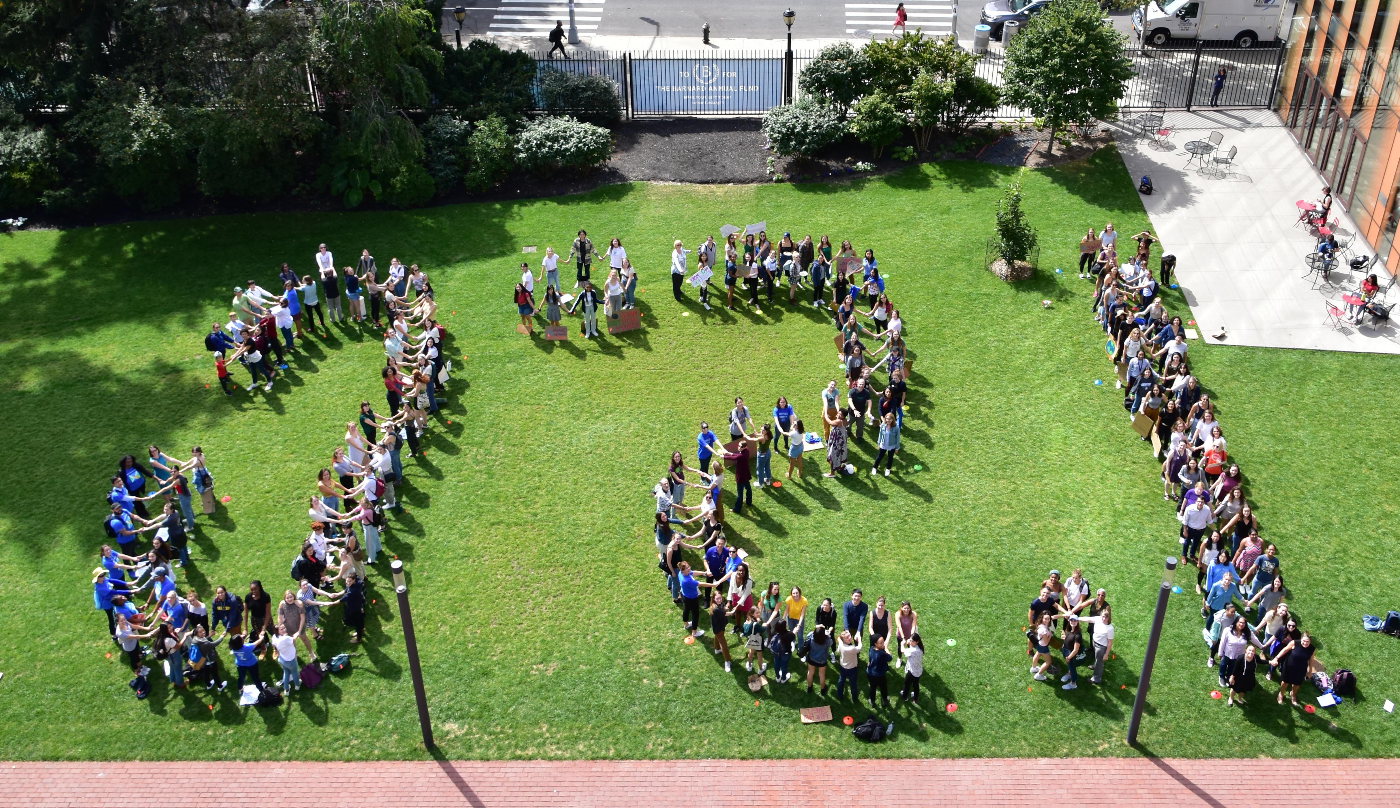 Students pose in the shape of 1.5 degrees celsius on the day of the climate strike 